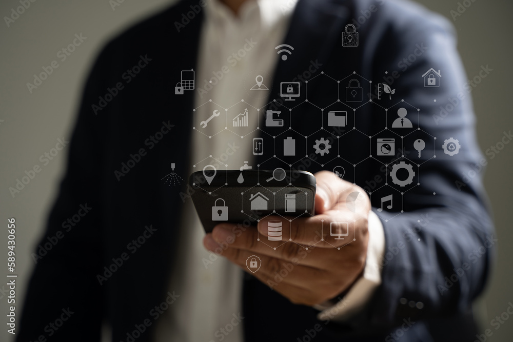 Poster man's hand holding a smartphone with media icons and symbols and application icons for multitasking.