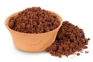 Dark muscovado sugar or Barbados sugar in wooden bowl isolated on white background