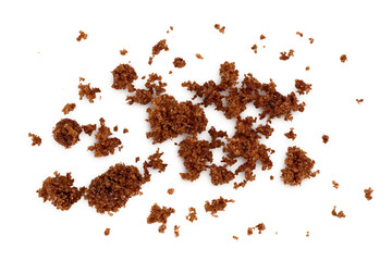 Dark muscovado sugar or Barbados sugar isolated on white background. Top view. Flat lay