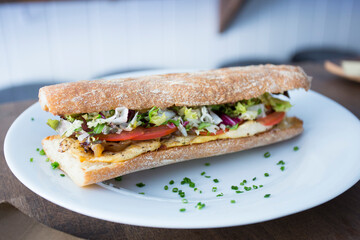 Delicious sandwich with chicken and salad.