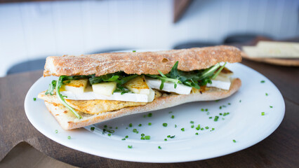 Delicious sandwich with chicken and salad.