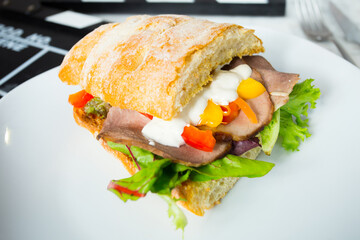Delicious sandwich with pork loin and cheese