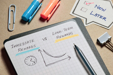 Immediate rewards vs Long-term rewards handwritten notes with graph on notebook. Hyperbolic...