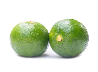 Two green lemon fruits with some drop on them isolated on white background with clipping path and shadow in png format