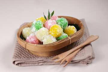 Cenil is Indonesian Traditional Snack Made from Grated Cassava, Served with Grated Coconut and Palm Sugar. 