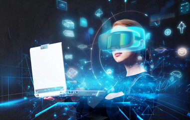 Blonde android female in VR glasses and laptop on dark background.