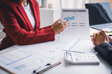Close up businessman hand using calculator and writing make note with calculate about finance accounting.finance accounting concept