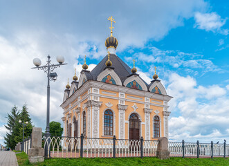 Fototapeta na wymiar Rybinsk, Russia. View of the chapel of St. Nicholas Wonderworker on the embankment of the Volga River.