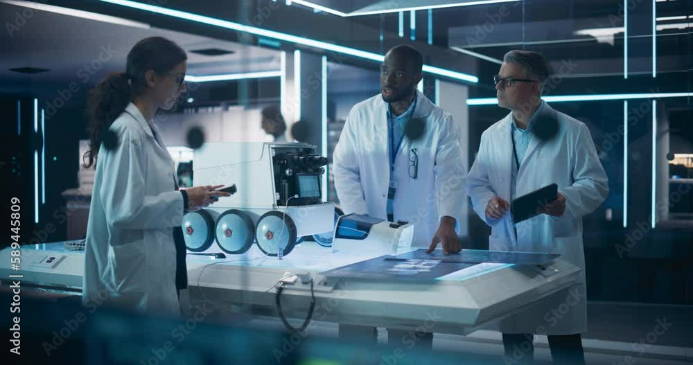Poster Industrial Robotics Specialists Working on a Mobile Robot, Using a Tablet Computer. Black African Engineer In Lab Coat Discussing an Automated AI Robotic Delivery Assistant with His Creative Team