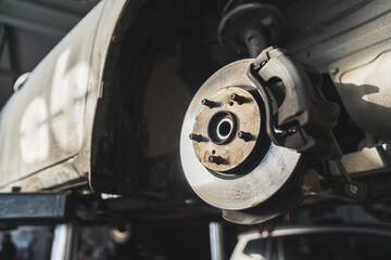 Disk brake and car disk brake system service concept - Car disk brake pad replacement service in the car garage. High quality photo