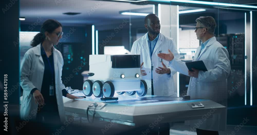 Poster Industrial Robotics Specialists Working on an Automated Mobile Delivery Transport. Female Scientist Loading a Parcel Cardboard Box into the Trunk of an Innovative Mobility Robot on Six Wheels