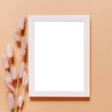 Blank greeting card, invitation and envelope mockup. Minimal floral frame made of dry flowers and branches. Flat lay, top view. Happy mother's day, birthday, wedding composition.
