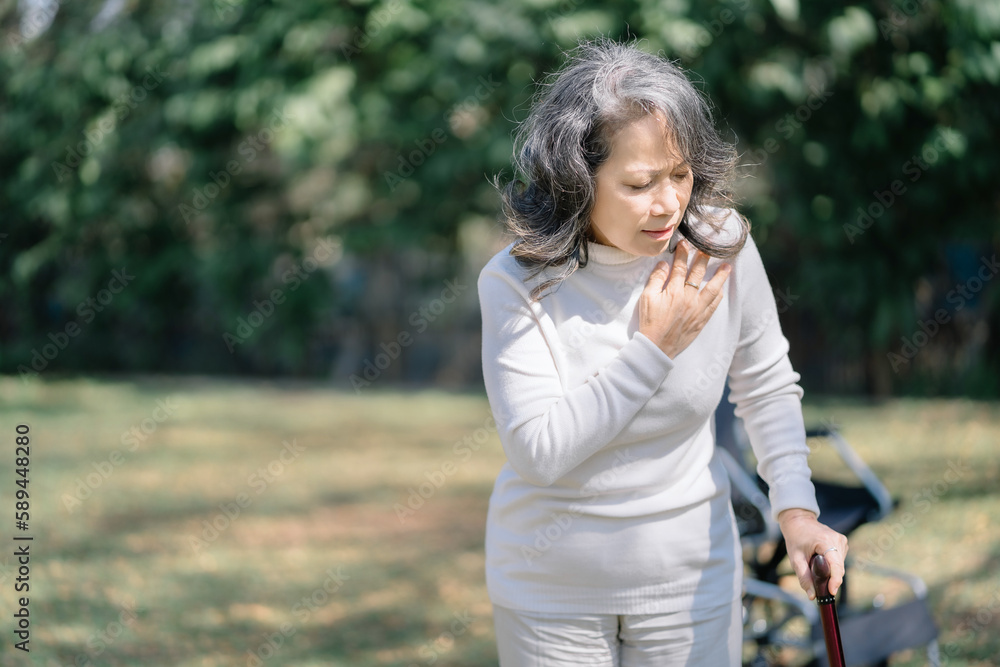 Wall mural elderly woman suffers chest pain, concept health in old age and heart problems.