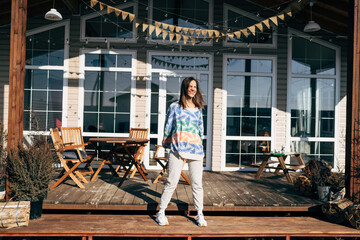 Fototapeta premium Fitness sport girl in fashion sportswear dancing hip hop in the street, outdoor sports, urban style