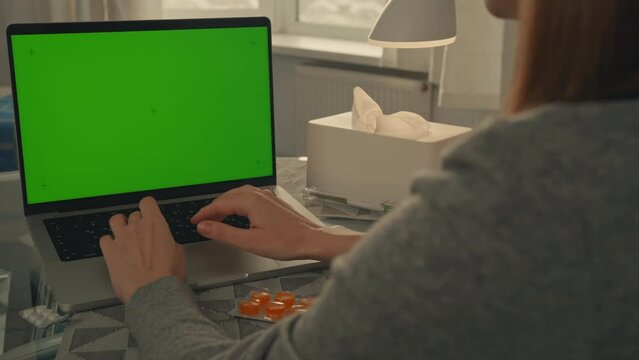 patient using laptop with green screen online consultation with doctor chatting with therapist