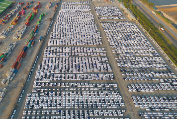 Aerial top view of new cars parking for sale stock lot row, dealer inventory import and export business commercial worldwide, Automobile and automotive industry distribution logistic global transport