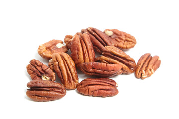 Peeled pecan nuts isolated on a white background. Heap of pecan halves