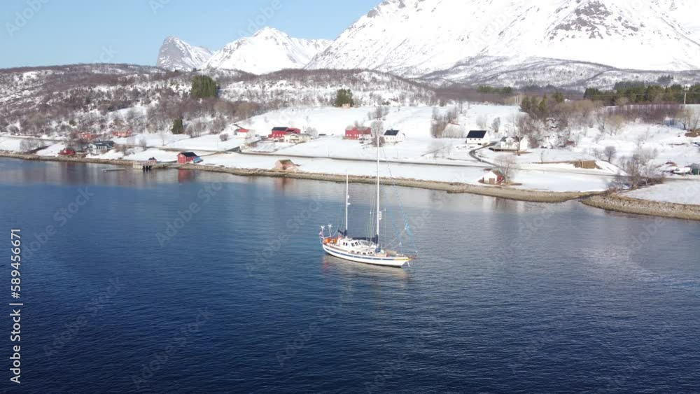 Sticker Aerial shot of a fishing boat on the coast of Lofoten in Nordland, Norway