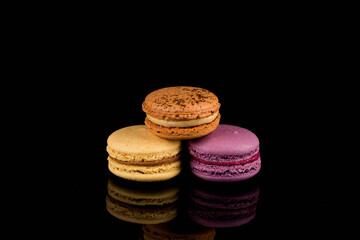 Colorful macaroon over black background