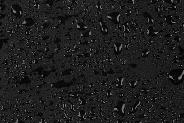 Water drops on dark stone