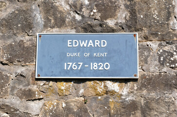 Metal Sign 'Edward Duke of Kent 1767-1820' on Old Rough Stone Wall 