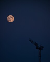 Fototapeta na wymiar Beautiful view of full moon on a blue sky background