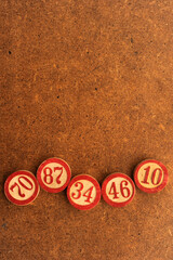 vintage wooden bingo markers wit numbers - obrazy, fototapety, plakaty