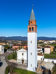 Fototapeta na wymiar Bell tower of the church of Raspano di Cassacco