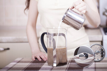 Making coffee with milk on the kitchen table