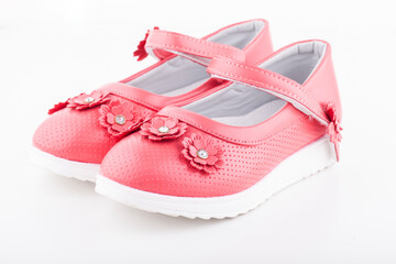 Shoes for the girl color coral on a white background