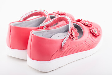 Shoes for the girl color coral on a white background