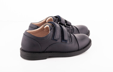 A pair of black leather shoes on a white background.