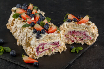 Ready-made, tasty meringue roll in cut. Close up