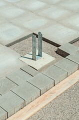 Vertical shot of a metal construction over a pavement