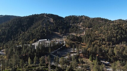 Obraz premium Landscape of dry forested hill under blue sunny sky
