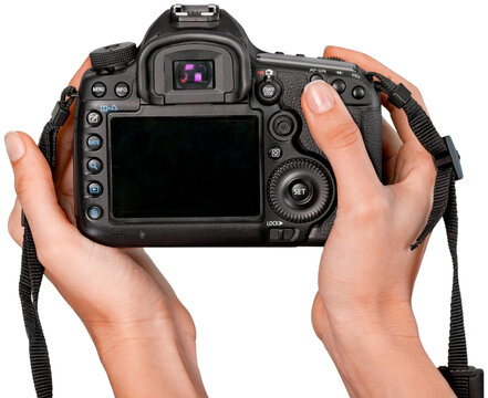 Hands holding modern camera isolated on white background