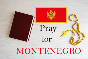 Pray for Montenegro. Rosary and Holy Bible background.