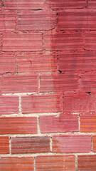 Pared de ladrillos pintada de rojo