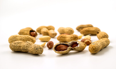 Dried peanuts in closeup on white