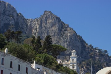 Fototapeta na wymiar Beautiful view of white buildings and rocks on Capri Island, Naples, Italy