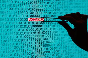 The concept of searching for a password in binary data. A hand with tweezers selects the word PASSWORD from the monitor screen among zeros and ones.