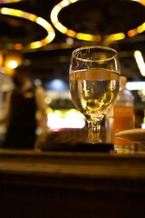Selective of a glass of white wine in a bar