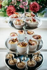 Vertical shot of the desserts in a cake stand