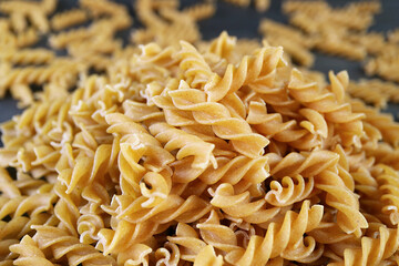 Pile of Uncooked Dried Whole Wheat Fusilli Pasta
