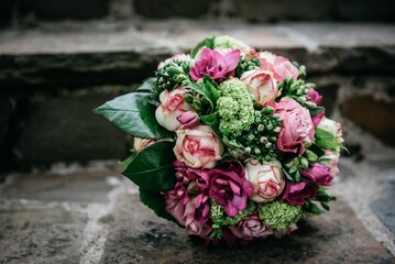 Closeup of the bouquet of the bride made of pink flowers