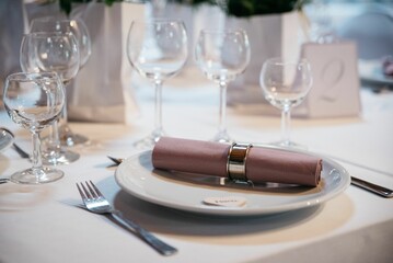 Table interior with white dishes and glasses