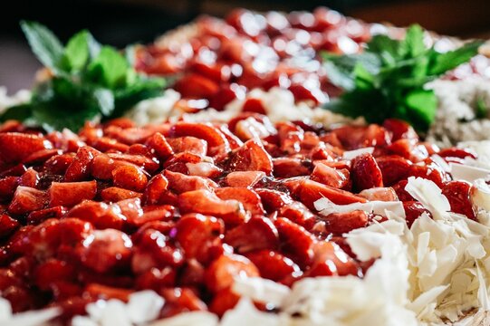 Selective focus shot of a pile of strawberry pieces displayed in a Bouffet