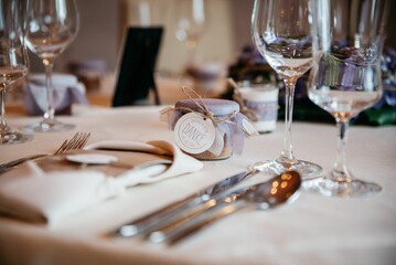 Table interior with white dishes and glasses