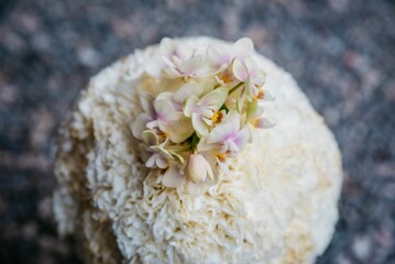 Closeup of a white wedding bouquet on the blurred background