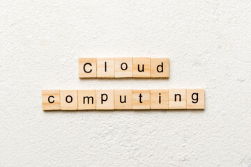 Cloud computing word written on wood block. Cloud computing text on cement table for your desing, concept
